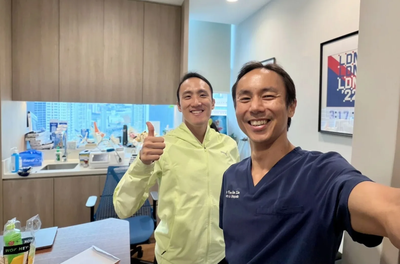 Dr Foo Gen Lin with a satisfied sports patient at Apex Sports Clinic, a sports doctor clinic in Singapore