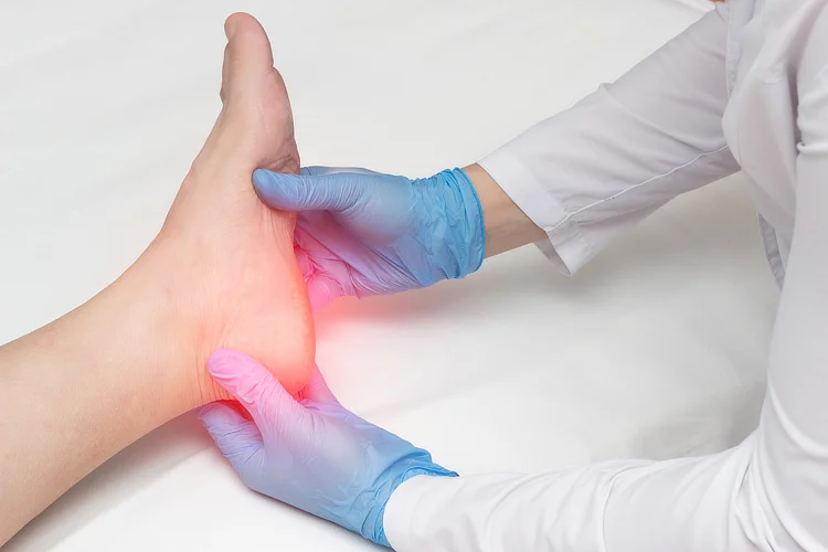 Foot specialist examining heel and arch to diagnose plantar fasciitis pain.