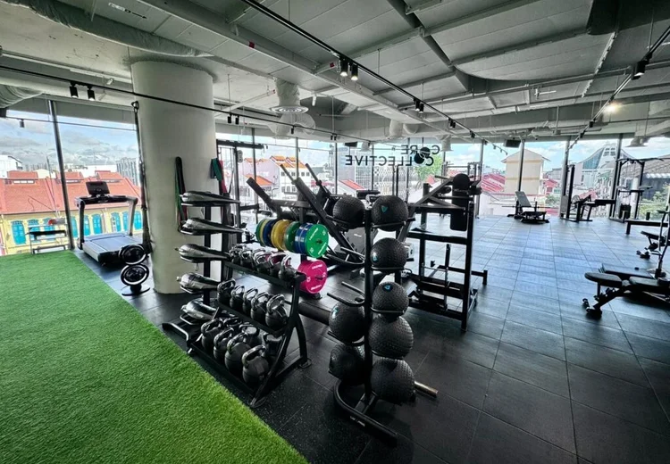 Partner rehabilitation and fitness centre at Apex Sports Clinic Singapore, equipped with specialised devices for recovery and strength building.