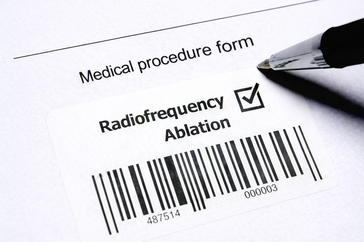 Medical procedure form labelled radiofrequency ablation with barcode and pen.