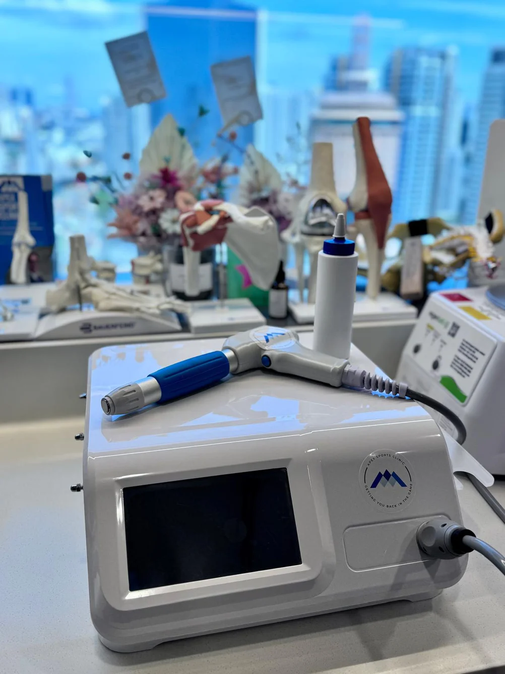 Shockwave therapy machine used for orthopaedic conditions at Apex Sports Clinic in Singapore.