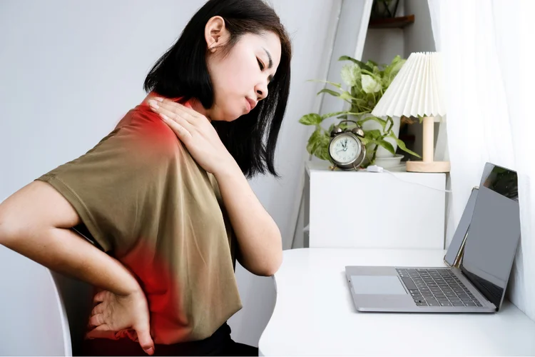 Woman with shoulder and back pain from poor posture.