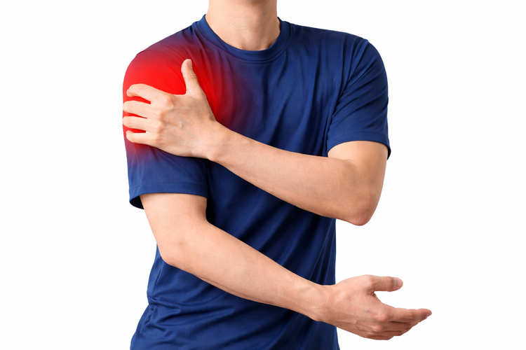 Man gripping shoulder with red highlight showing pain from frozen shoulder.