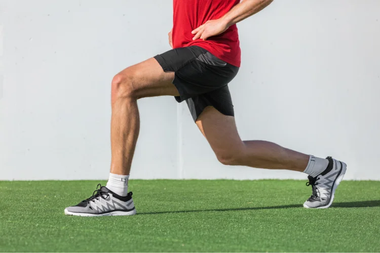 Man doing lunges to support ACL rehabilitation.